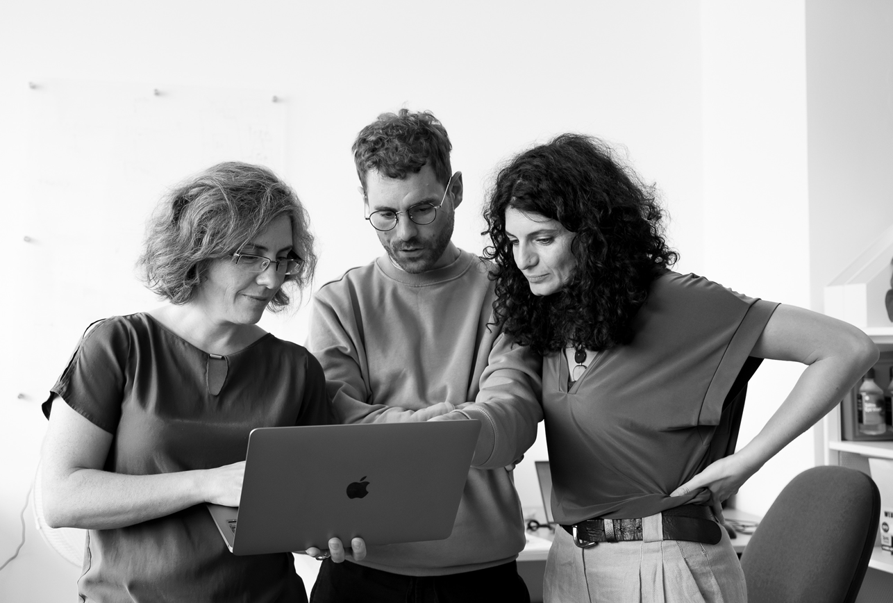 team looking at laptop