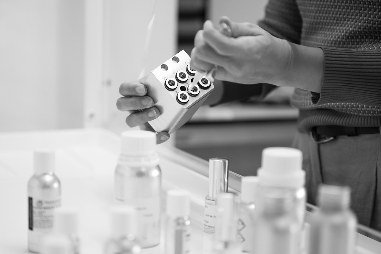 Closeup of team member in lab filling cartridges