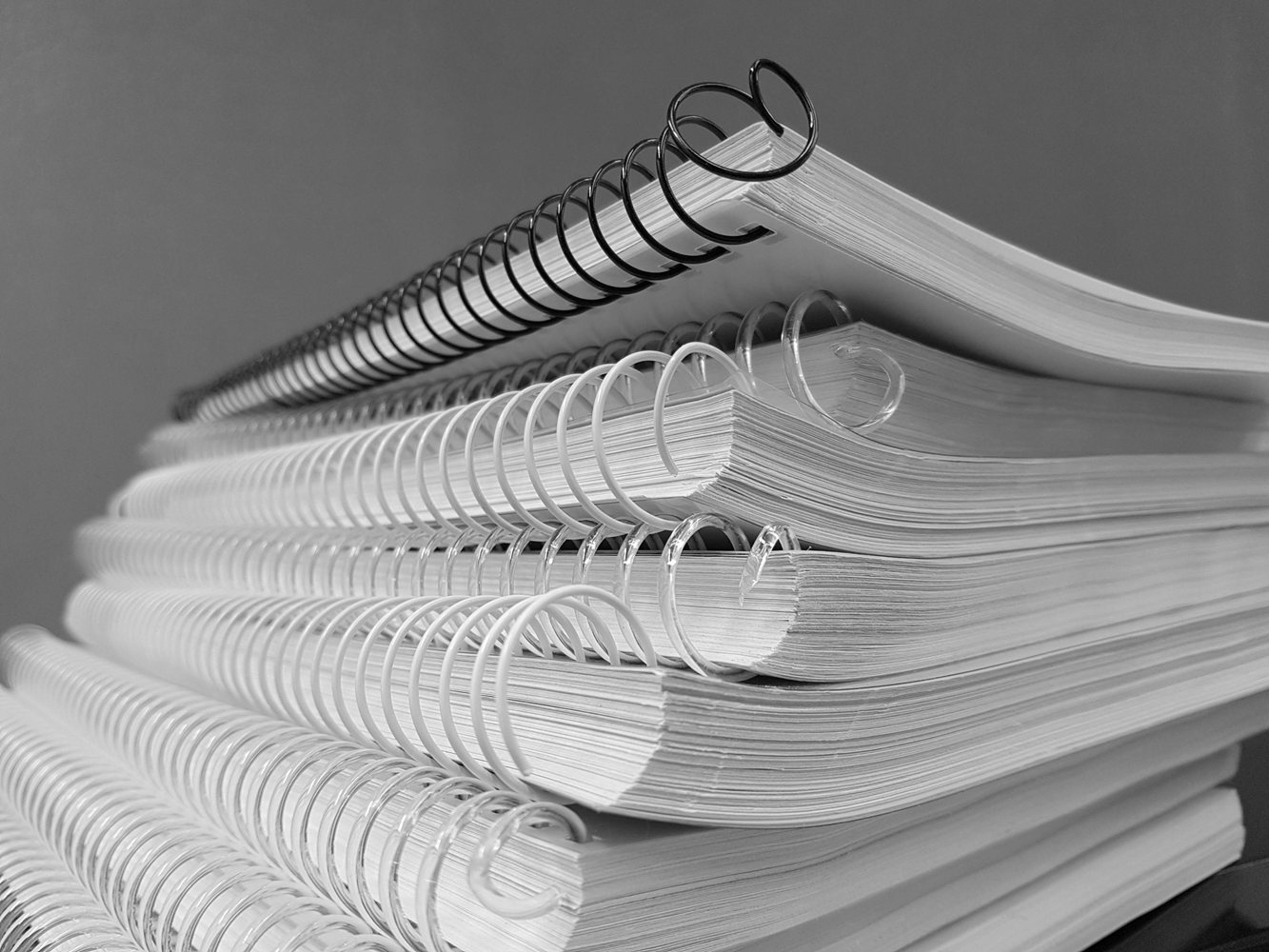 Stack of ringbound notebooks journals